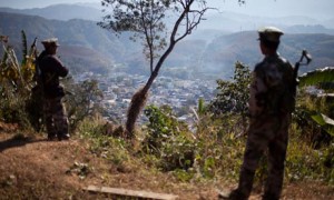 Kachin Independence Army soldiers guard a post on a hilltop overlooking the town of Laiza. Photograph: Alexander F. Yuan/AP