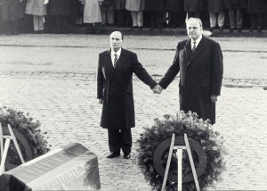 French President Mitterrand and German Federal Chancellor Kohl participated in a memorial service for fallen soldiers at Verdun in 1984 . As the national anthems of both countries played, Mitterand and Kohl joined hands – a gesture of friendship symbolizing the lessons learned from a frightful past.